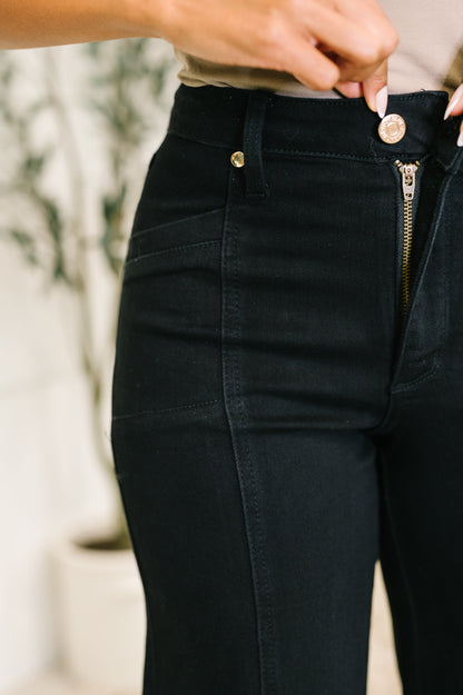 Close-up of black pants with a blurred background