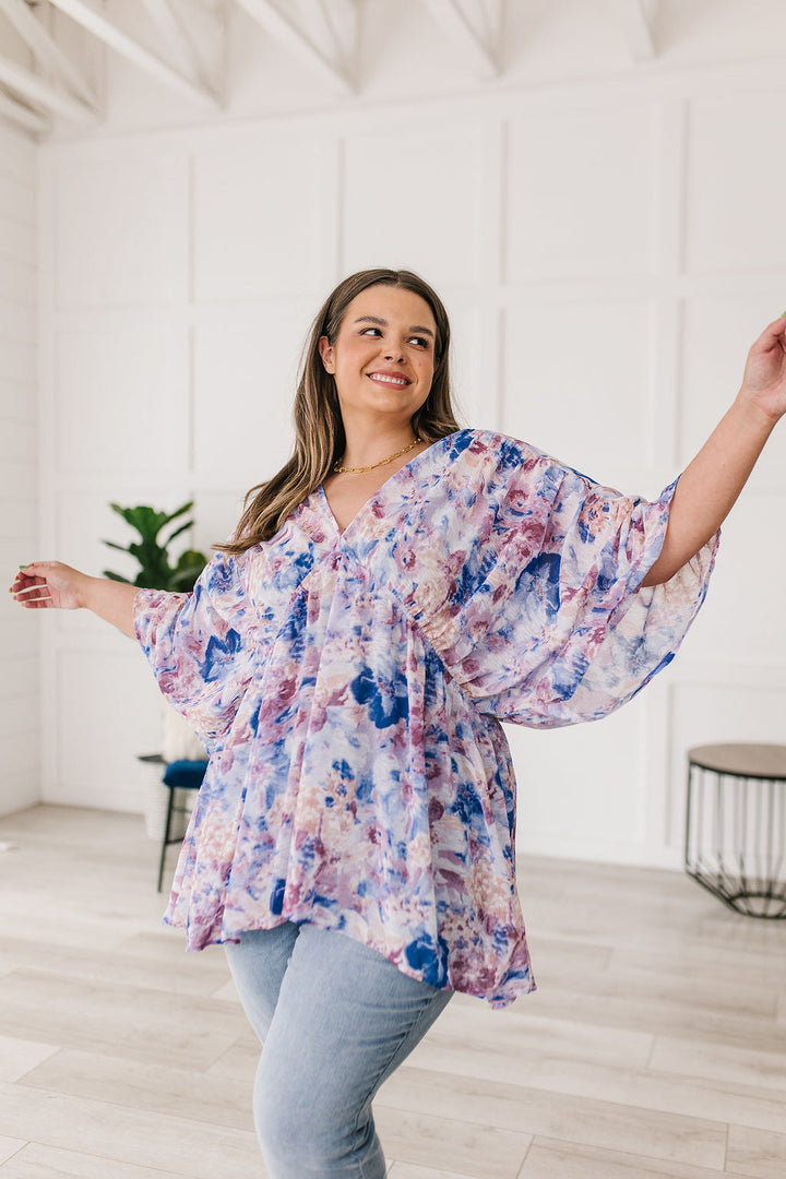 Fabled in Floral Draped Peplum Top in Blue!