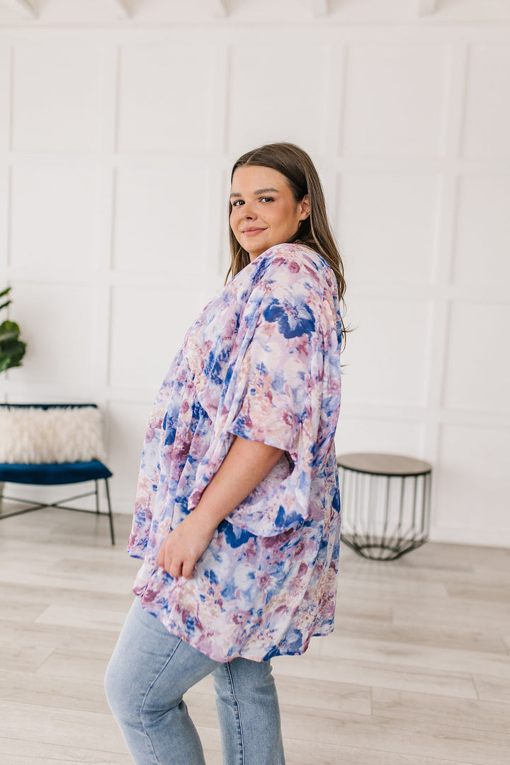 Fabled in Floral Draped Peplum Top in Blue!