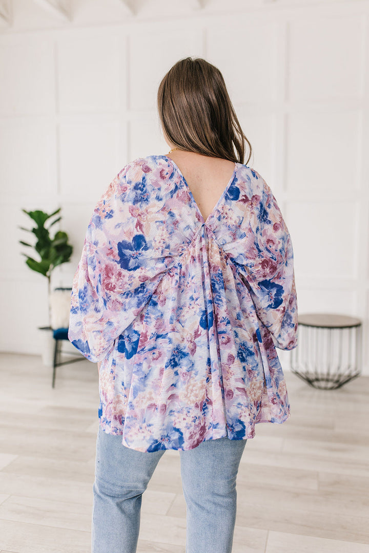 Fabled in Floral Draped Peplum Top in Blue!