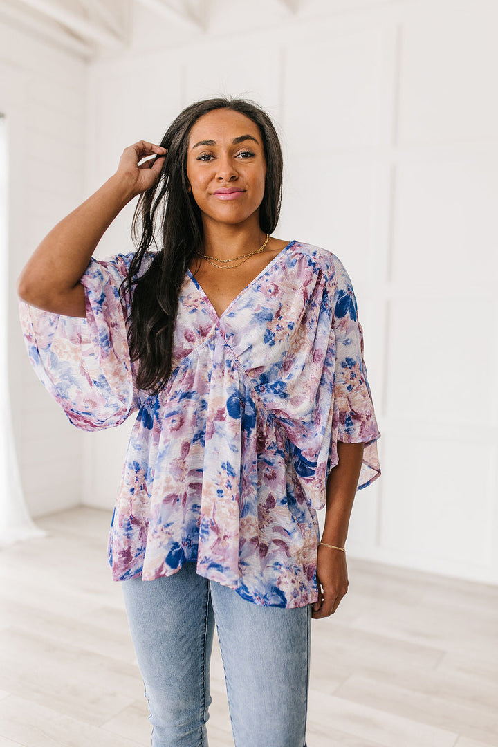 Fabled in Floral Draped Peplum Top in Blue!