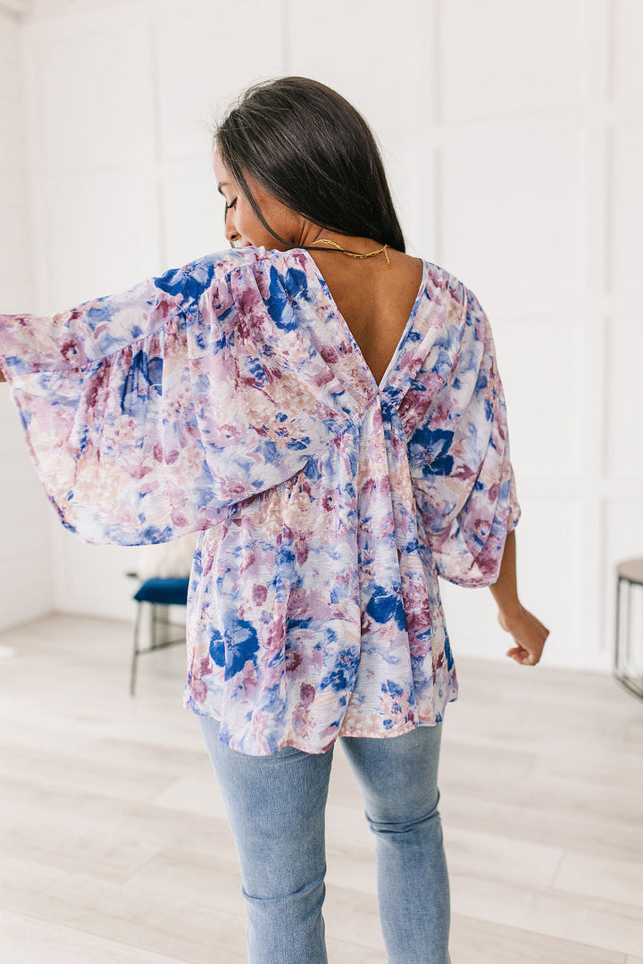 Fabled in Floral Draped Peplum Top in Blue!