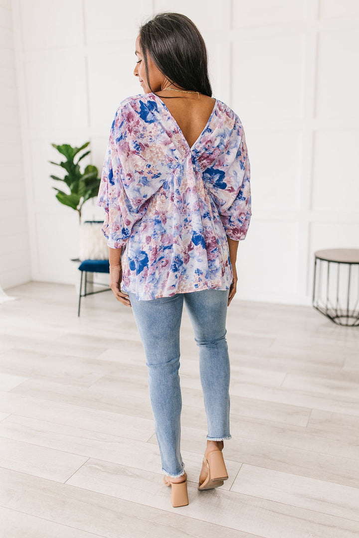 Fabled in Floral Draped Peplum Top in Blue!