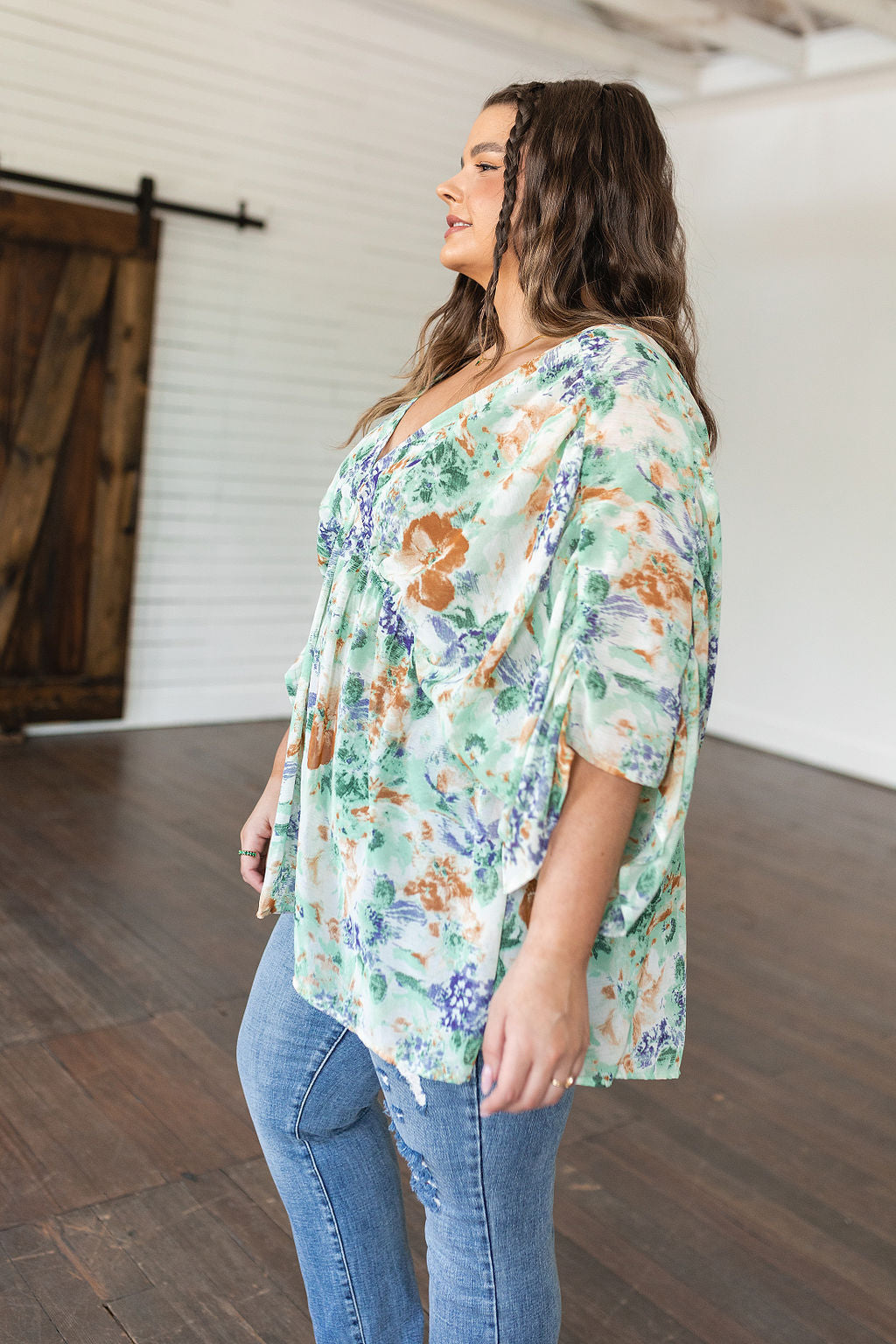 Fabled in Floral Draped Peplum Top in Ivory!