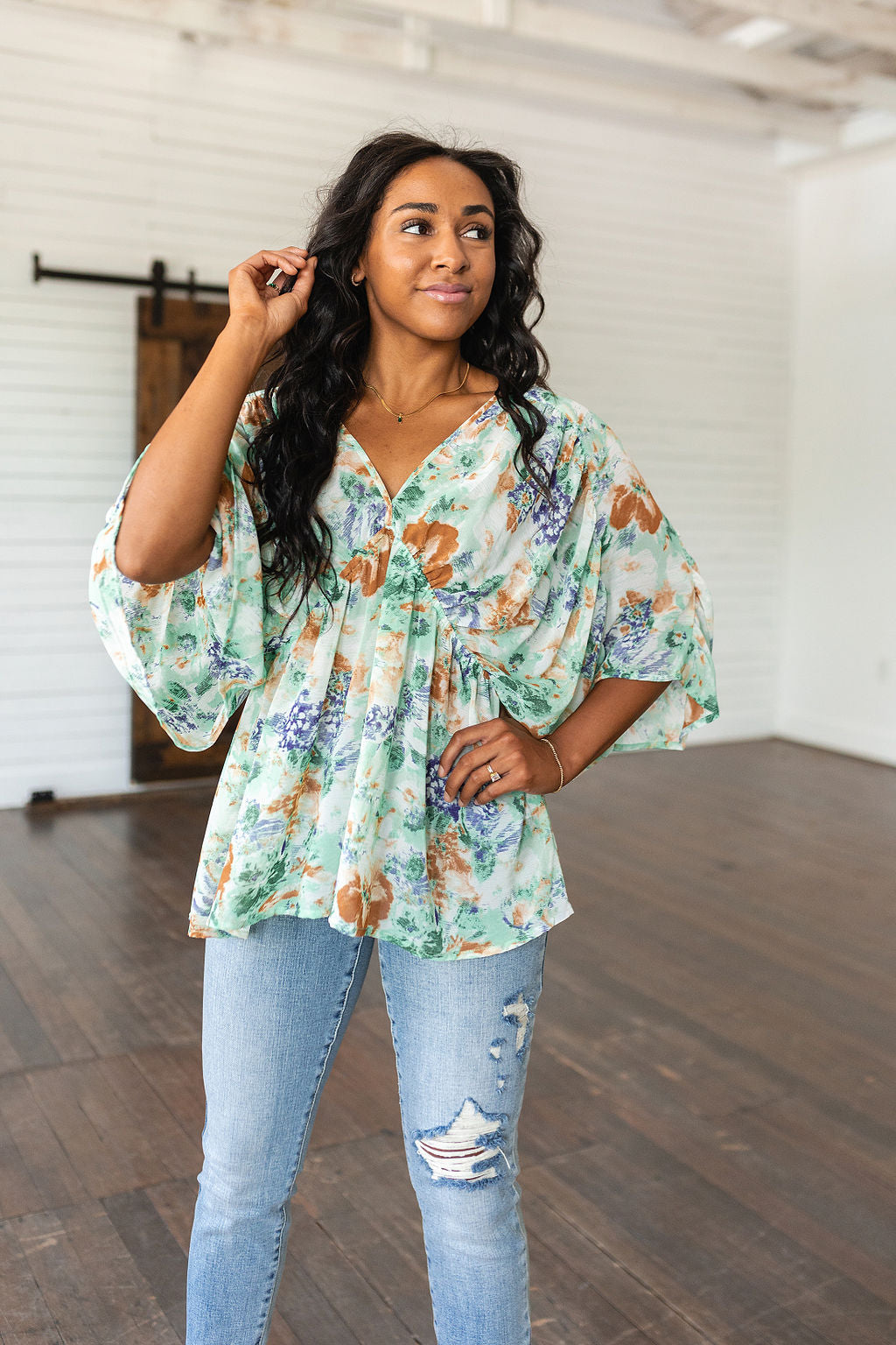 Fabled in Floral Draped Peplum Top in Ivory!