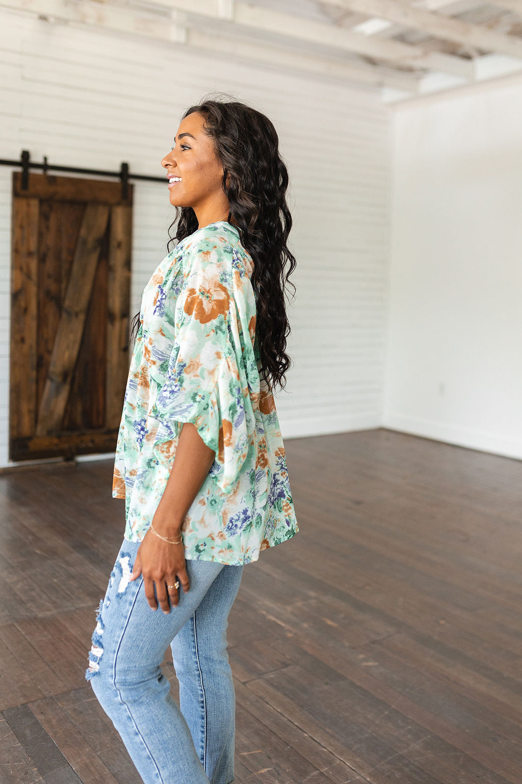 Fabled in Floral Draped Peplum Top in Ivory!