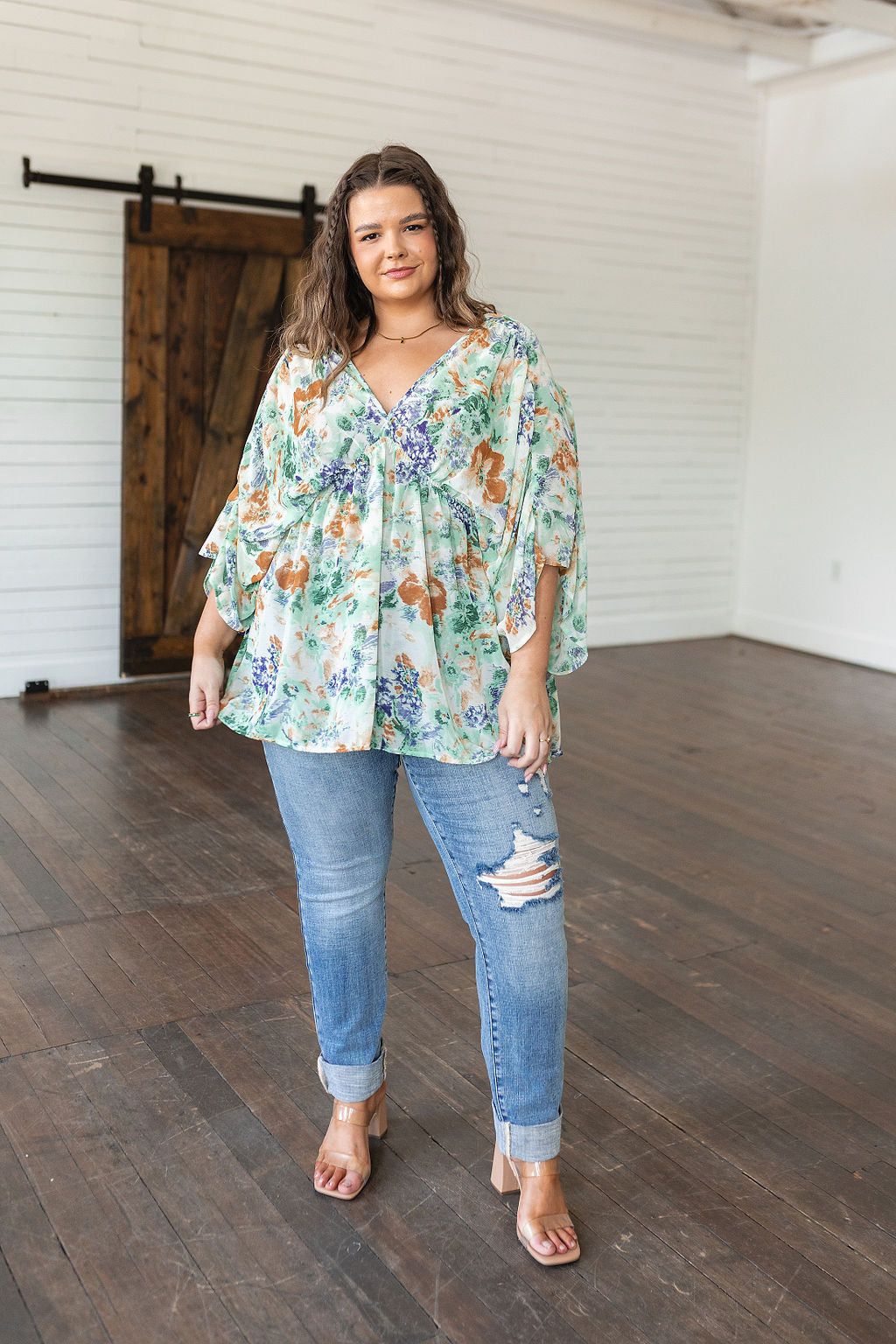 Fabled in Floral Draped Peplum Top in Ivory!