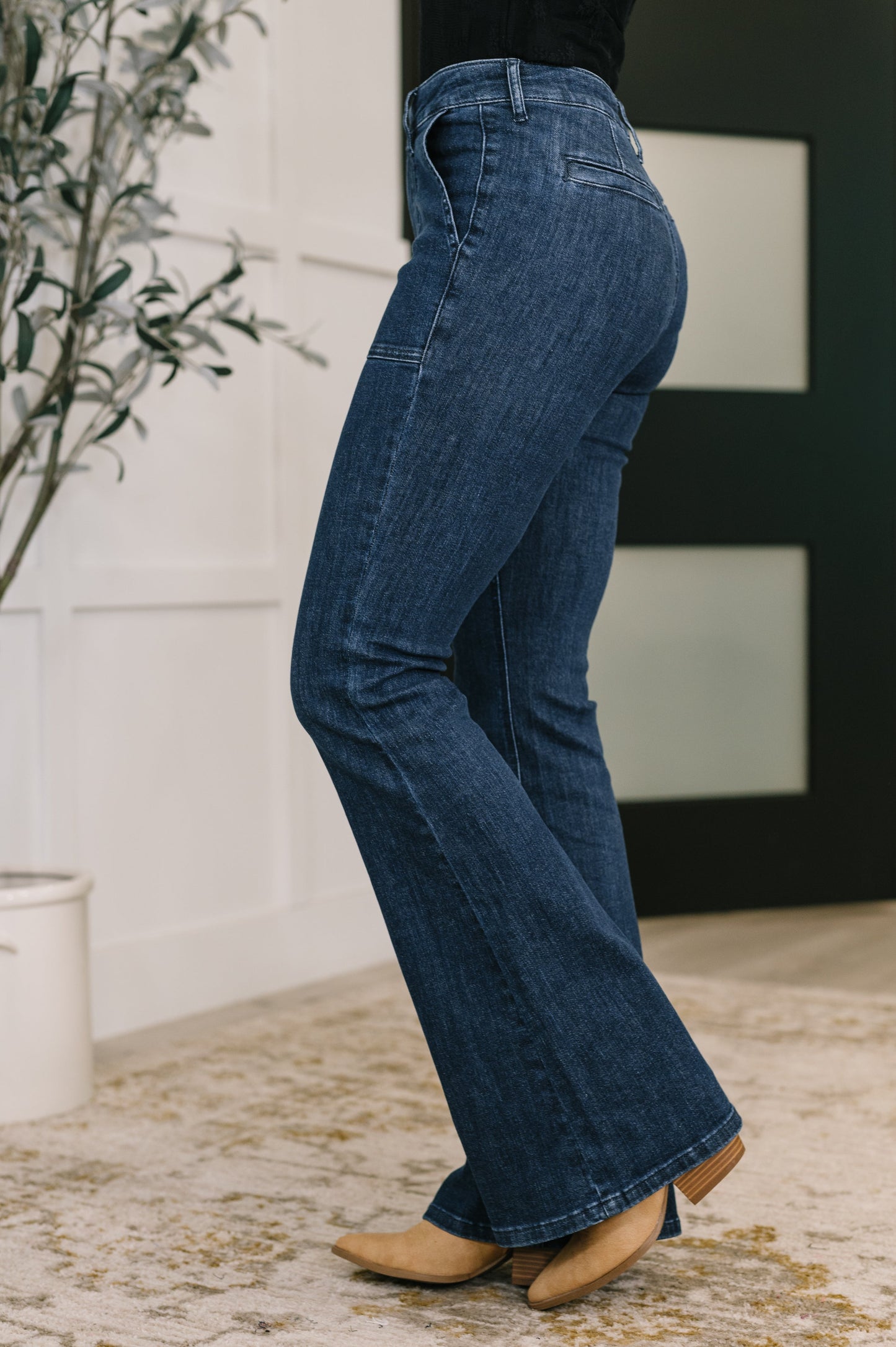 Person wearing blue jeans with a blurred background