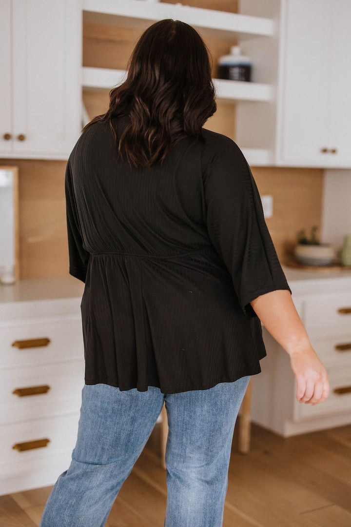 Storied Moments Draped Peplum Top in Black!