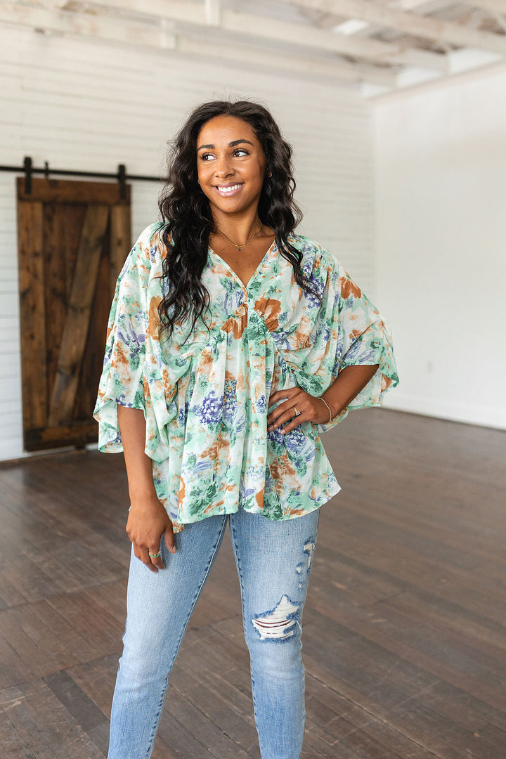 Fabled in Floral Draped Peplum Top